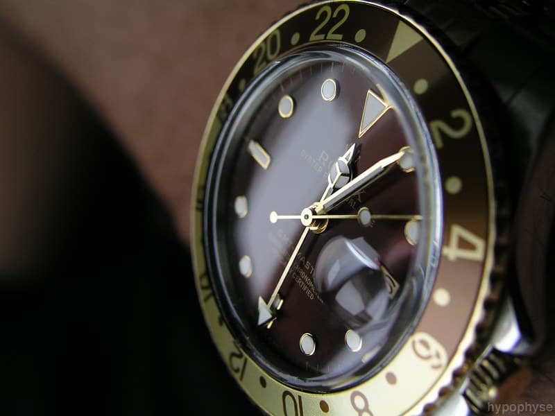 The same 16753 on the wrist, showing the root-beer bezel, brown nipple dial and gold hands. · Photo: hypo.physe (Flickr) · CC BY-SA 2.0 · https://creativecommons.org/licenses/by-sa/2.0/ · Source: https://www.flickr.com/photos/hypophyse/4334113225/