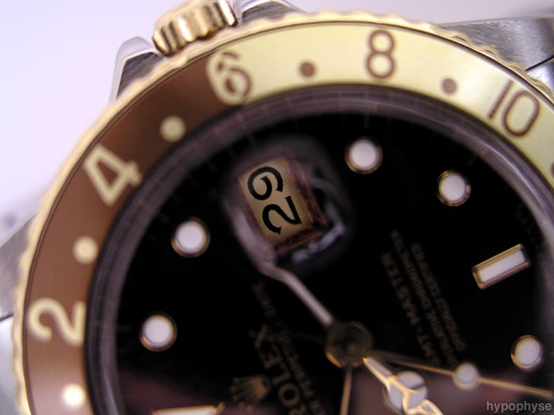 Rolex GMT-Master 16753 close-up: two-tone case with brown-and-gold “root beer” bezel, nipple dial markers and quickset date. · Photo: hypo.physe (Flickr) · CC BY-SA 2.0 · https://creativecommons.org/licenses/by-sa/2.0/ · Source: https://www.flickr.com/photos/hypophyse/4237507918/