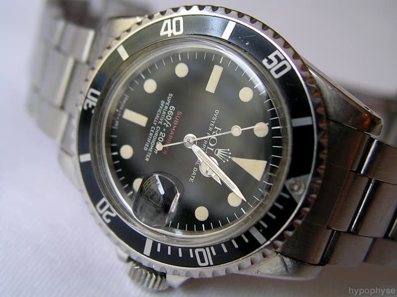 Second view of the same 1680 Red Sub: red “Submariner”, feet-first depth rating, matte dial with date window. · Photo: hypo.physe (Flickr) · CC BY-SA 2.0 · https://creativecommons.org/licenses/by-sa/2.0/ · Source: https://www.flickr.com/photos/hypophyse/4279725169/