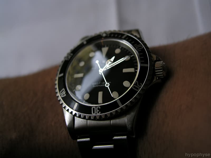 The same 5513 seen head-on: feet-first “660ft=200m” line above “Submariner” on the matte two-line dial; no date, no chronometer text. · Photo: hypo.physe (Flickr) · CC BY-SA 2.0 · https://creativecommons.org/licenses/by-sa/2.0/ · Source: https://www.flickr.com/photos/hypophyse/4279733937/