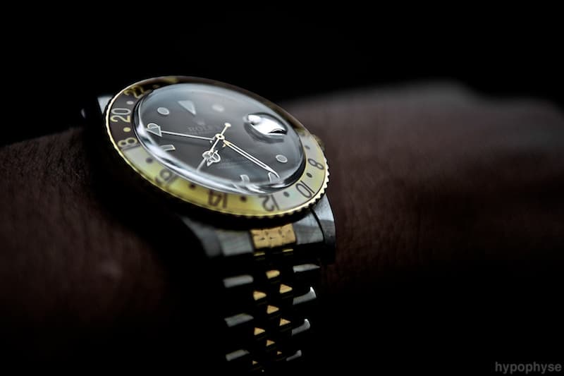 Low-light wrist shot of the 16753, two-tone on Jubilee with the gold-and-brown bezel. · Photo: hypo.physe (Flickr) · CC BY-SA 2.0 · https://creativecommons.org/licenses/by-sa/2.0/ · Source: https://www.flickr.com/photos/hypophyse/4666000019/