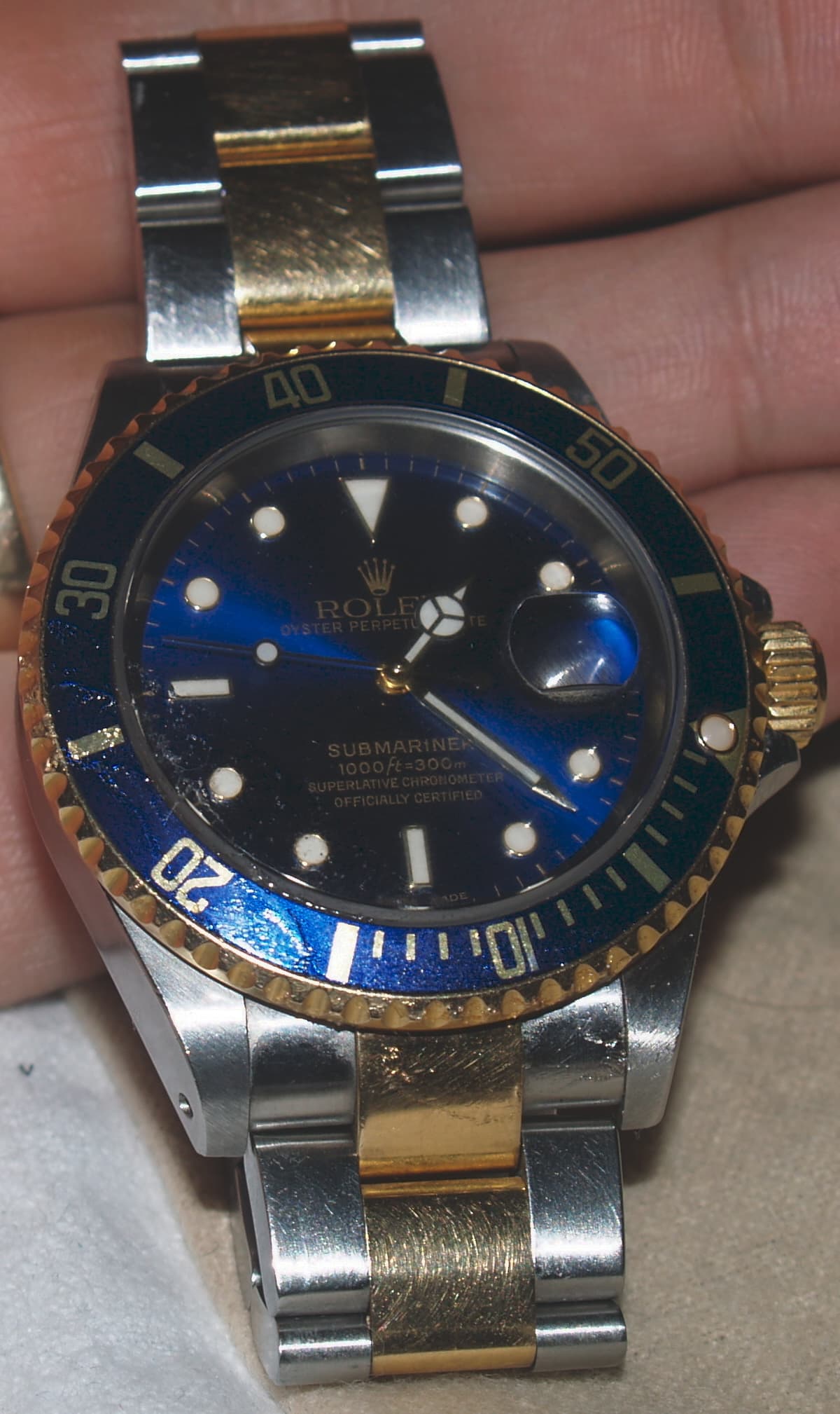 Two-tone Rolex Submariner Date ref. 16613, cropped dial-side view; reference stated in the file name and source description. · Photo: Eternalsleeper (English Wikipedia) · Public domain · Source: https://commons.wikimedia.org/wiki/File:Mysub16613x_cropped.jpg